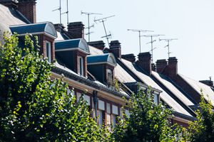 Charming rooftops and antennas in Amiens, showcasing classic French architecture on a sunny day.